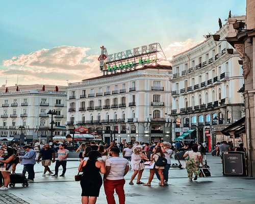 People walking in Madrid city center during a sunny day